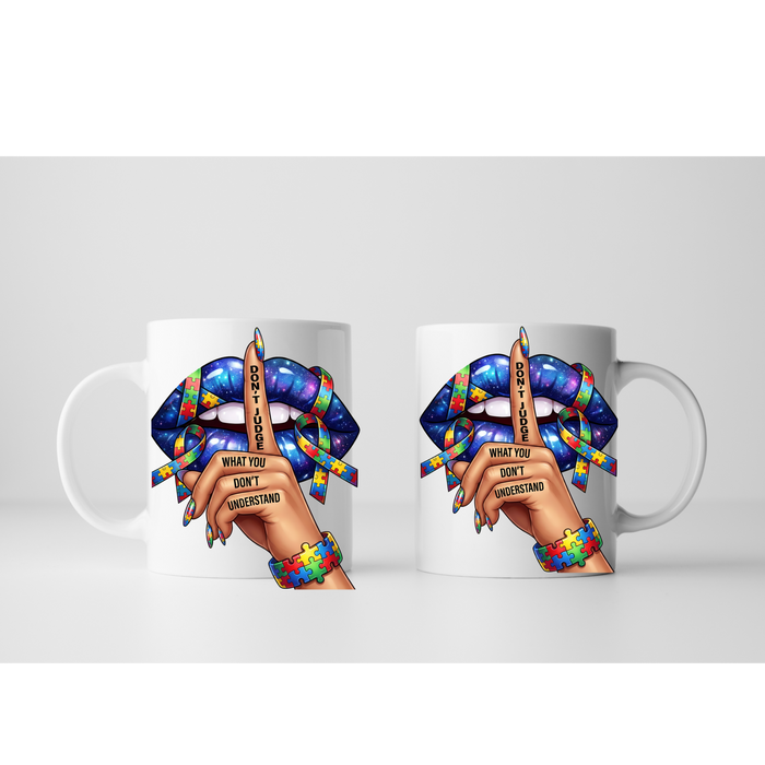 White ceramic autism awareness mug with colorful puzzle design and quote
Close-up of “Don’t Judge What You Don’t Understand” autism mug design