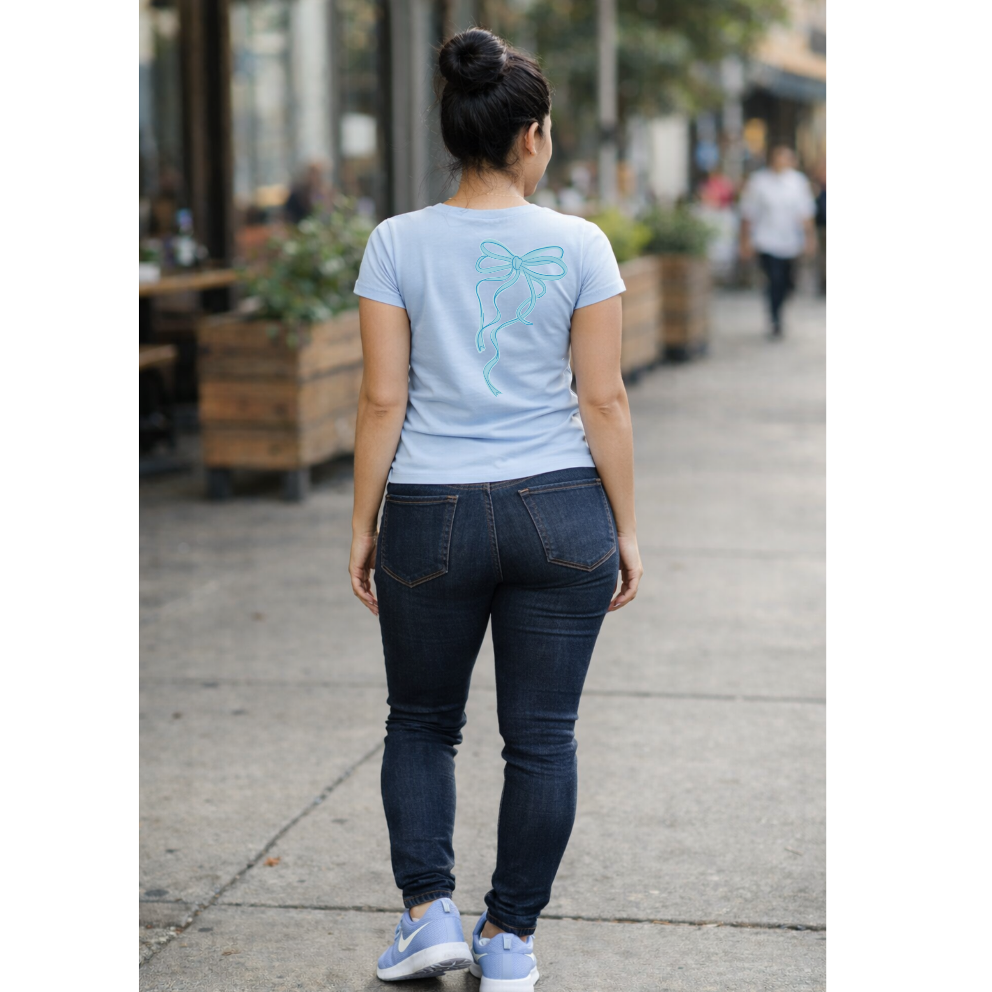 Back of autism awareness shirt with simple bow graphic detail