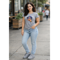 Model wearing gray autism awareness shirt with colorful puzzle hands design