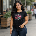 Dog mama t-shirt with pink paw print design, cute dog mom graphic tee worn with jeans, trendy pet lover outfit